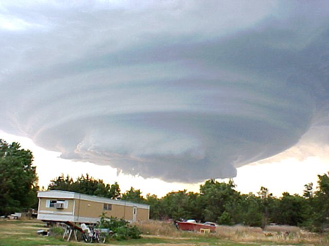 Wall cloud and cloud-base striations in Ravenna, NE, 2002-07-24, courtesy Gregg Hutchison.