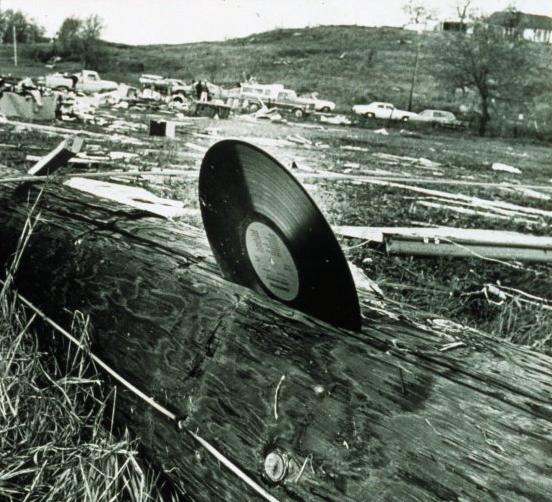 A phonograph record blown into a telephone pole, courtesy NOAA.